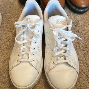 All white Adidas sneakers